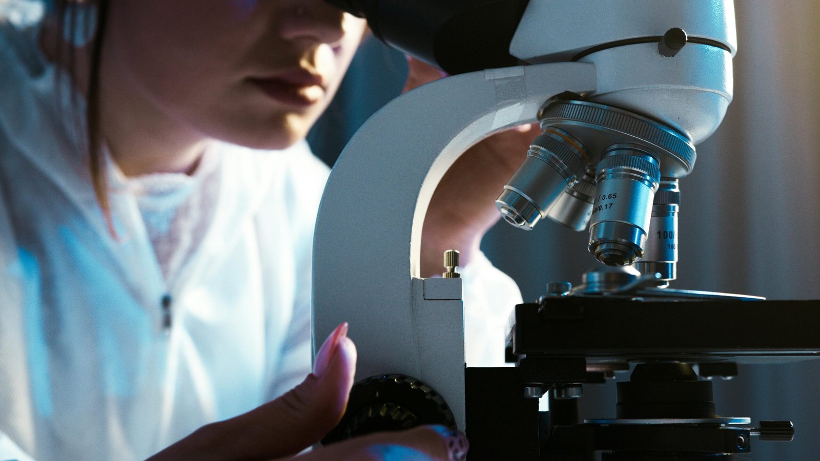 Woman using a laboratory Microscope for aquatic ecology